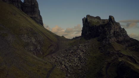 Flying-atop-a-high-cliff-on-the-Quiraing-Walk-reveals-the-blue-sea,-Isle-of-Skye,-Scotland-Highlands