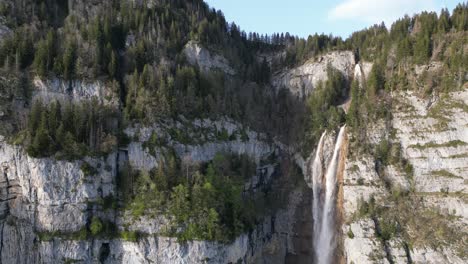 Waterfall-by-mountain-side-in-beautiful-nature-landscape-Switzerland