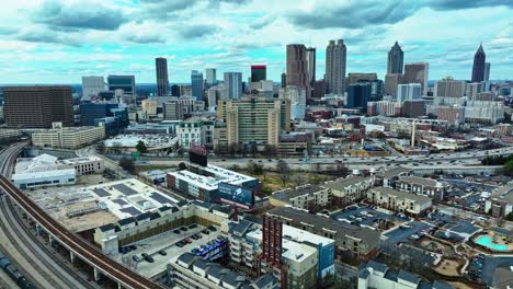 Atlanta-City-Skyline-And-Road-Traffic-In-Georgia,-United-States---Aerial-Shot