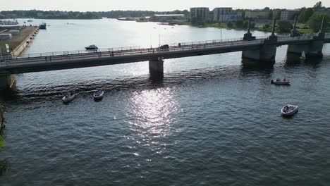 Low-flyover-of-Kesklinna-sild-bridge-over-river-in-Parnu,-West-Estonia