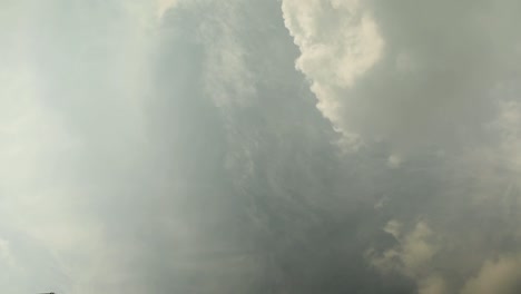 Timelapse-of-clouds-evolving-in-a-dramatic-dance,-showcasing-nature's-beauty-and-power,-dynamic-sky-view