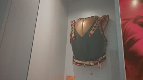Ornate-chest-armor-on-display-in-Trakoscan-Castle's-weapon-room,-Croatia-museum-exhibit