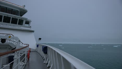 Cruise-Ship-on-Arctic-Expedition-Sailing-in-Cold-Sea-Water-With-Misty-Horizon,-Passenger-POV