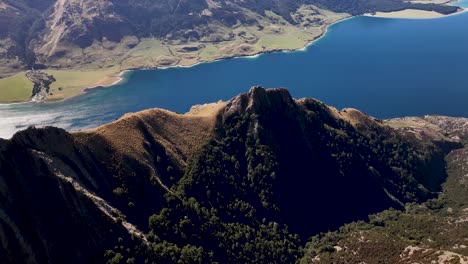 Drone-lookout-from-Isthmus-Peak-to-mountain-range-by-Lake-Hawea,-travel-destination,-New-Zealand