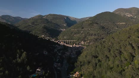 A-quaint-village-nestled-in-the-lush-green-mountains-of-the-french-riviera,-aerial-view