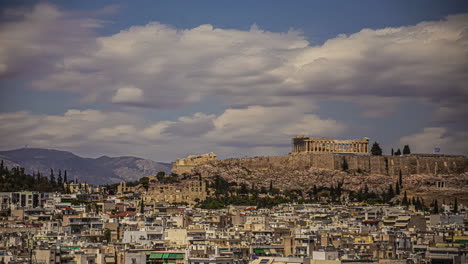 Acropolis-of-Athens,-Greece-overlooking-the-city---cloudscape-time-lapse