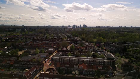 Suburban-apartment-residential-buildings-on-city-outskirts-in-fall,-aerial