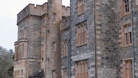 Close-up-pan-of-Lews-Castle-exterior-facade-in-Stornoway,-Outer-Hebrides-of-Scotland-UK