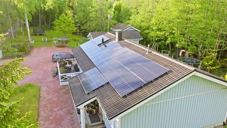 Aerial-view-of-a-solar-powered-detached,-countryside-house,-summer-day-in-Finland