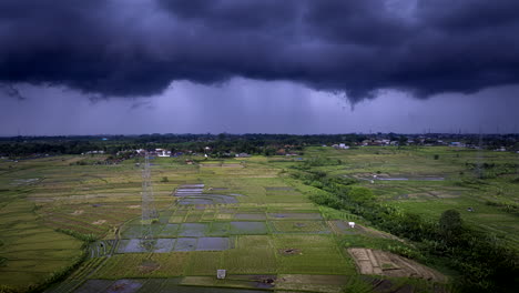 Dramatic-stormy-cumulus-clouds-over-rice-fields