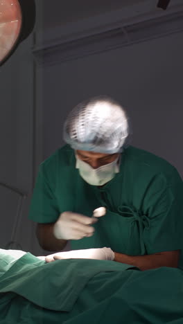 A-surgeon-diagnosing-and-identifying-heart-problems-in-an-elderly-woman-and-performing-a-cardiovascular-surgical-procedure