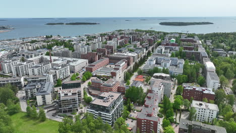 Aerial-tracking-shot-of-the-Drumso-cityscape,-sunny-spring-day-in-Helsinki,-Finland