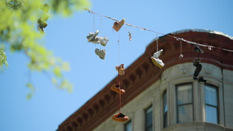 Shoes-Hang-from-Wire-in-Harlem-NYC-on-Sunny-Spring-Day