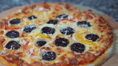 A-chief-puts-Mozzarella-on-an-Italian-pizza,-close-up-shot,-insert-shot
