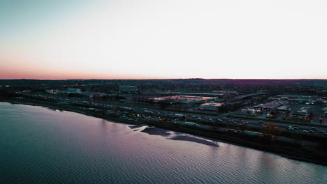 Twilight-aerial-above-Long-Island-Sound-showcasing-New-Haven-Connecticut,-USA