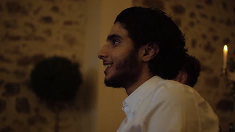 Slow-motion-shot-of-a-young-man-enjoying-the-wedding-with-a-toothpick