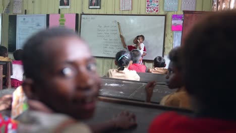 Teacher-teaching-class-with-baby-in-hand-Indonesian-school-system