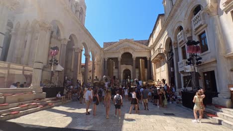 People-Crowd-sightseeing-Diocletian-Roman-Palace-in-old-city-of-Split,-Croatia