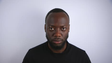 Black-Male-Looking-Up-In-An-Angry-State-With-White-Background