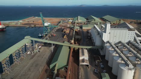 Unloading-iron-of-cargo-train-at-mining-factory-in-Esperance-Town,-Australia