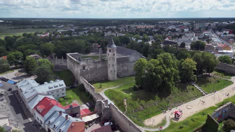 Flyover-of-medieval-ruins-of-Haapsalu-Castle,-in-Estonia-Baltic-city