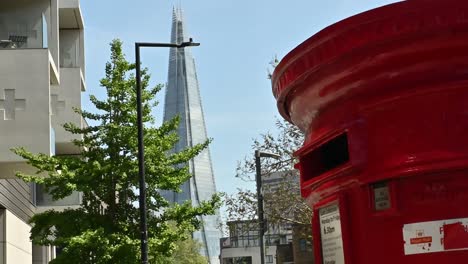 Royal-Mail-Post-Box-In-Front-Of-The-Shard,-London,-United-Kingdom
