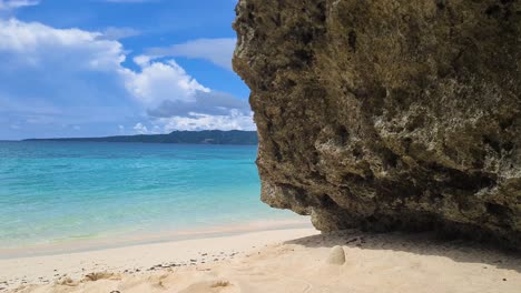 Empty-Beach-With-White-Sand-and-Rock-on-Exotic-Tropical-Island-and-Turquoise-Sea-Water-60fps