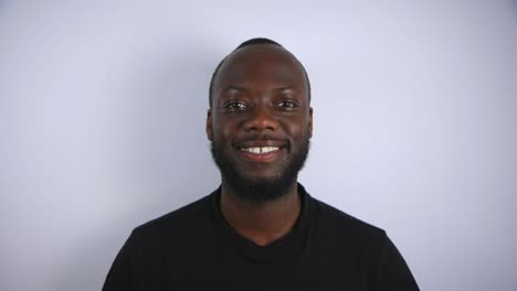 Black-Male-Smiling-Into-Camera-With-White-Background