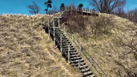 Drone-descending-against-the-dune-and-walkways