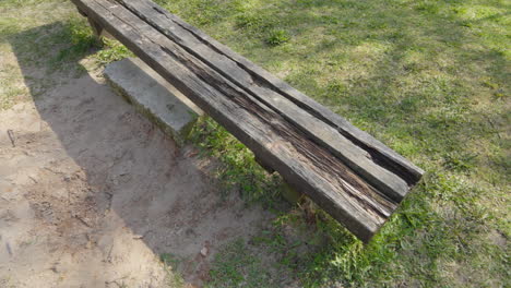 Broken-and-weathered-wooden-bench,-close-up-view