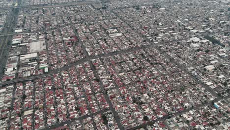 Drone-capturing-the-vastness-of-suburbs-of-Mexico-City,-municipality-of-Ecatepec
