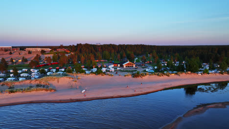 Drone-circling-the-beach-and-coastline-of-Kalajoki-dunes,-sunset-in-Finland