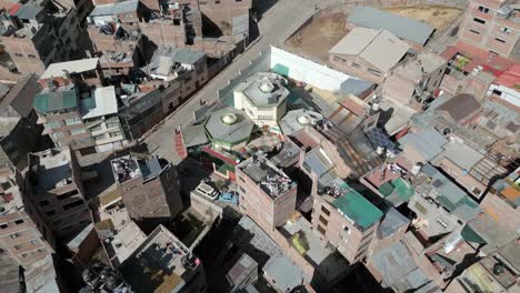 Aerial-view-of-the-city-of-Puno,-close-up-to-the-buildings,-Per?