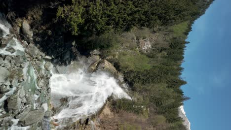 Drone-flying-over-Nardis-Waterfall,-Trentino,-Italian-Alps,-Italy
