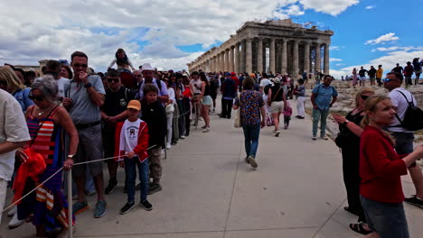 Slow-motion-shot-of-huge-queue-of-tourists-waiting-outside-of-Acropolis-of-Athens-in-Greece-on-a-cloudy-day
