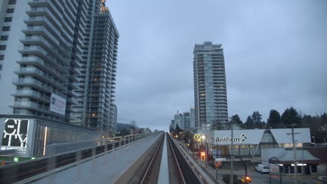 POV-Train-Crossing-Downtown-City-In-Vancouver,-Canada