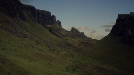 Low-altitude-flight-through-breathtaking-highlands-on-the-Quiraing-Walk,-Isle-of-Skye,-Scotland