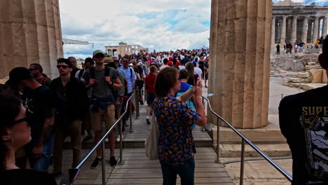 Famous-attraction-with-crowd-of-people---Acropolis-of-Athens,-moving-forward-slow-motion-view