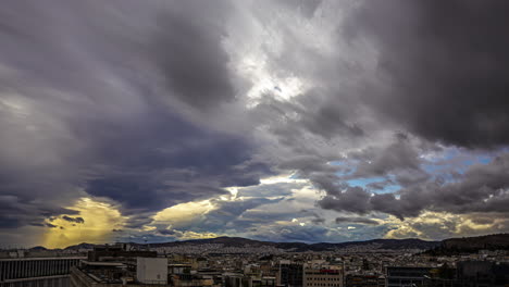 Stormy-clouds-flowing-above-cityscape-of-Athens,-time-lapse-view