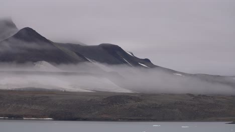 Landscape-and-Coastline-Scenery-of-Island-in-Arctic-Circle,-Hills-and-Fog-Above-Tundra