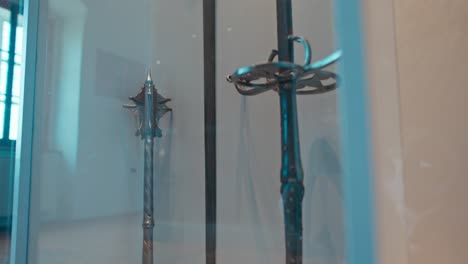 Medieval-maces-and-swords-on-display-in-the-weapon-room-of-Trakošćan-Castle,-Croatia