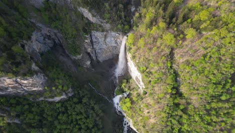 Static-aerial-view-of-Seerenbachfälle-waterfall-during-daytime-in-Amden,-Switzerland