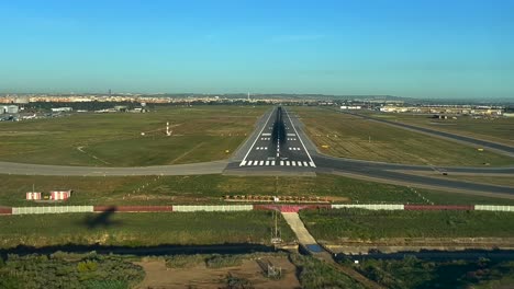 Airplane-shadow-over-the-ground-during-a-real-time-landing