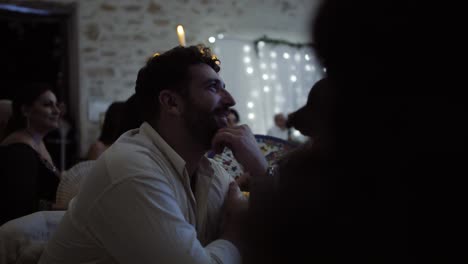 Slow-motion-shot-of-guests-laughing-at-the-speeches-at-a-wedding-reception