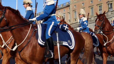 Tourists-Watch-Swedish-Royal-Guards-On-Horses-At-King-and-Queen's-Parade-At-Royal-Palace-In-Stockholm,-Sweden,-Slow-Motion