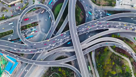 Bird-Eye-View-Shanghai-Interchange-Crossroad-Commuters-Commuting-Multiple-Lanes-With-High-Traffic-Vehicles-At-Cloudy-Day