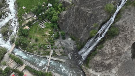 High-drone-flight-over-mantoka-waterfall-in-skardu
