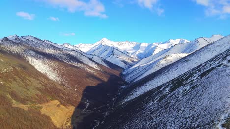 Mountains-of-Yakutia-in-spring-from-a-drone-against-the-blue-sky-4k