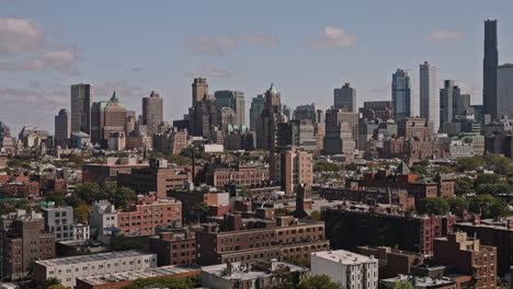 NYC-New-York-Aerial-v203-low-drone-flyover-Cobble-Hill-residential-neighborhood-capturing-brownstone-and-brick-buildings-against-Brooklyn-downtown-cityscape---Shot-with-Inspire-3-8k---September-2023