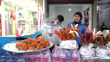Street-food-on-display-for-sale-during-the-21st-Pokhara-street-festival-in-Lakeside,-Nepal